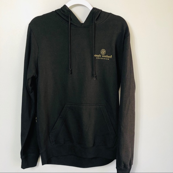 black hoodie with gold writing